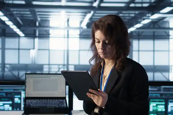 Doctor reviewing secure digital patient records and prescription data on a computer in a healthcare