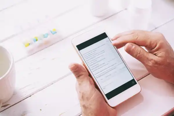Patient checking an electronic prescription expiry reminder notification on a smartphone in Australia