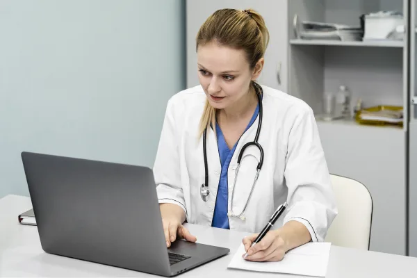 Doctor reviewing documentation request for a backdated medical certificate during consultation