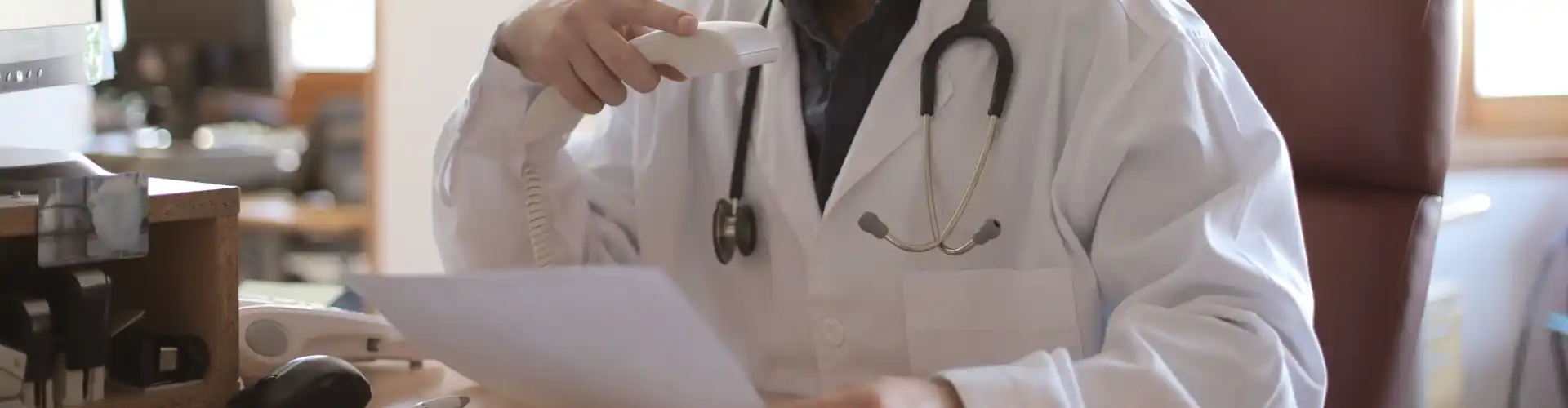 Patient accessing a digital prescription summary from an online healthcare portal on a laptop