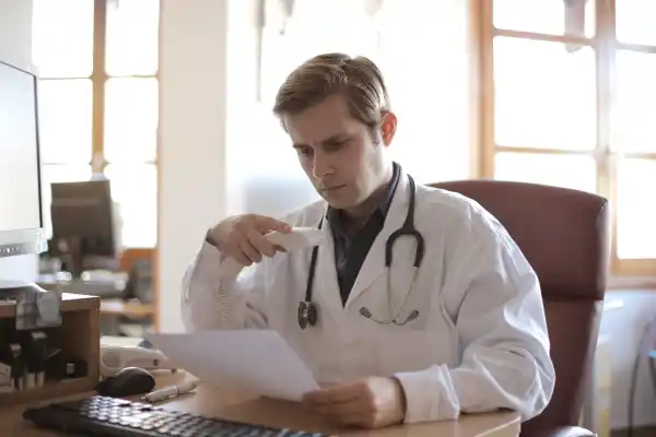 Patient accessing a digital prescription summary from an online healthcare portal on a laptop